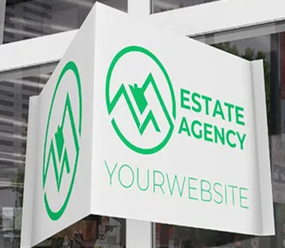 szyld reklamowy z logo i napisem „Estate Agency” zamontowany nad wejściem do biura nieruchomości.